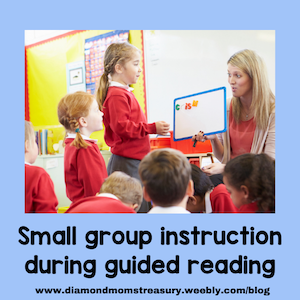 teacher holding letter board and instructing a small group of children