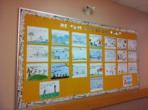 Bulletin board display with pictures of ways to take care of our world.