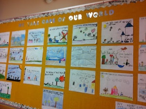 View of bulletin board display with pictures of ways to take care of our world.