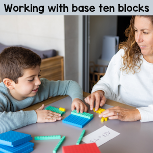 Child and woman working with base ten blocks